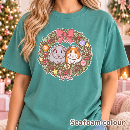 Model wearing the Seafoam Christmas guinea pig T-shirt.