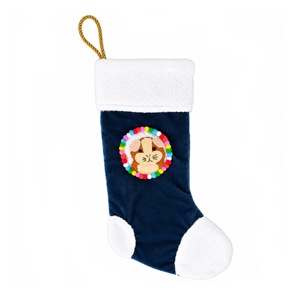 Handmade fluffy ginger and cream guinea pig Christmas stocking with navy blue recycled velvet, soft white cuddle fleece trim, felt guinea pig character, colourful pom-poms and gold rope hanging loop.
