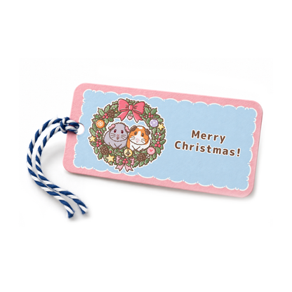 Christmas gift tag featuring Earl Grey and Teacake in a festive wreath with Merry Christmas message and blue and white twine