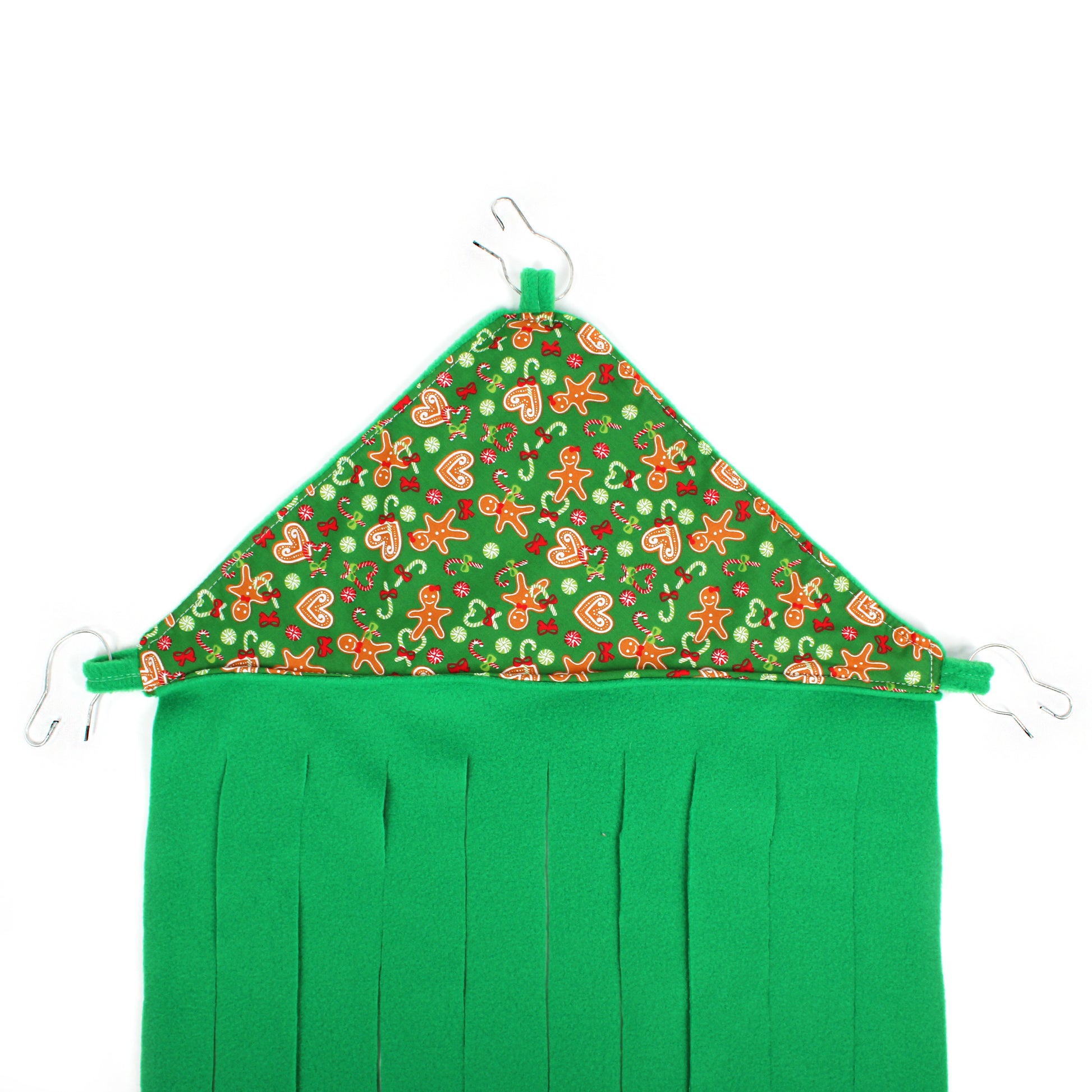 Green fabric with festive gingerbread pattern on a white background