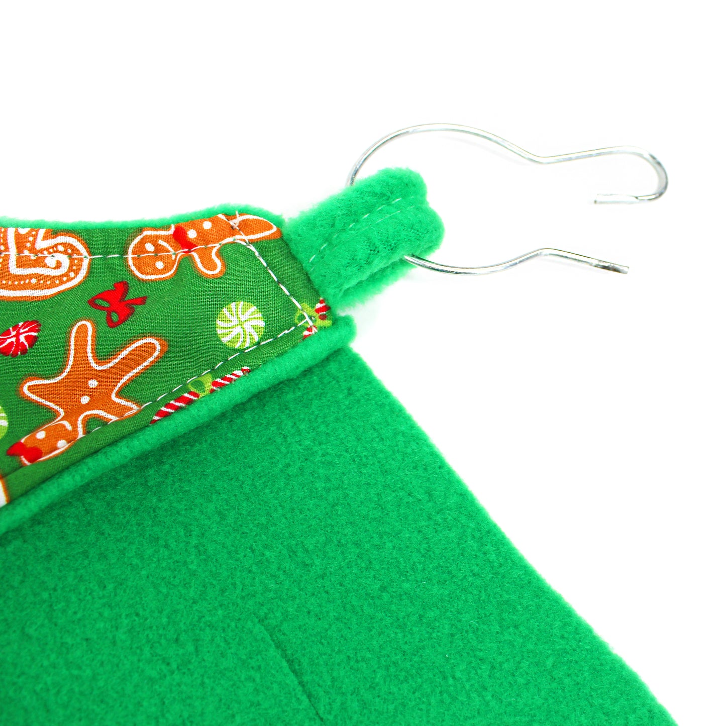 Green fabric with a hanger on a white background