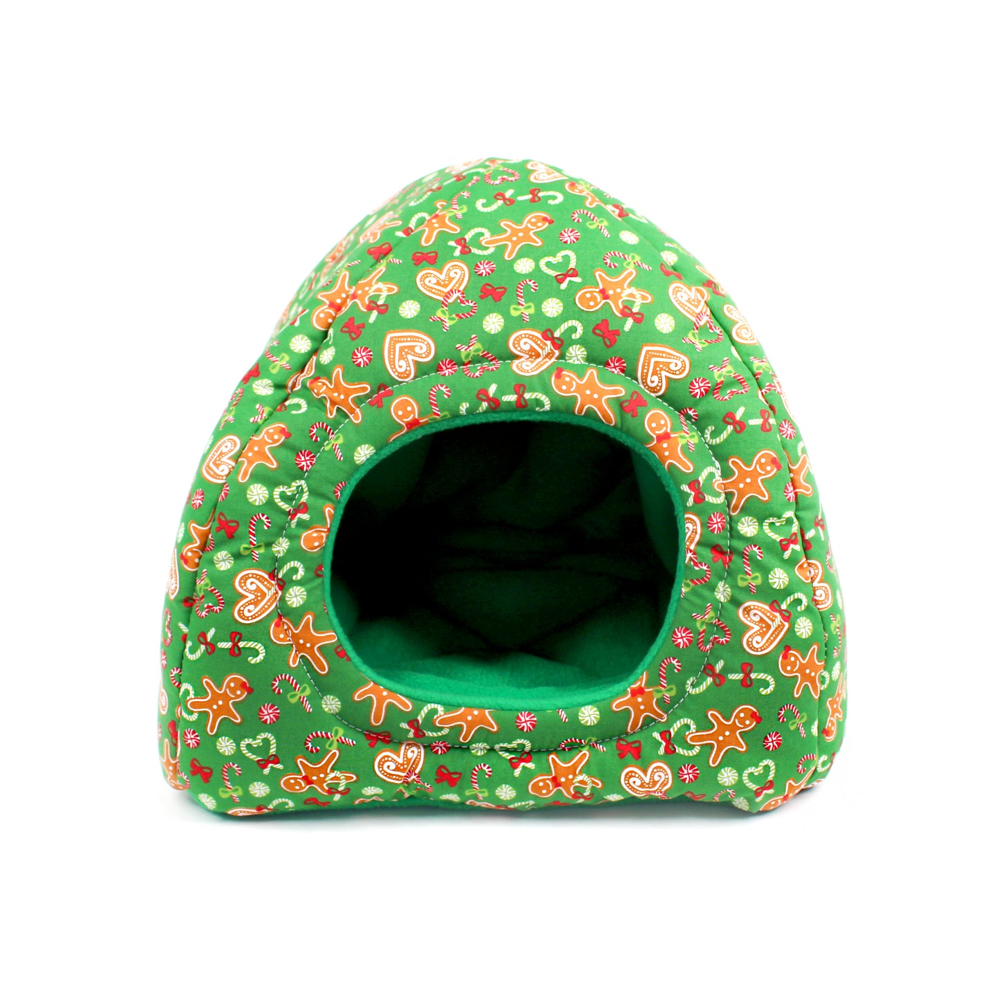 Green pet bed with gingerbread man pattern on a white background