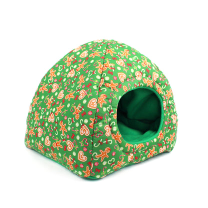 Green pet bed with gingerbread man pattern on a white background