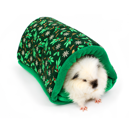 Guinea pig peeking out of a handmade Christmas snuggle tunnel with dark green holly print cotton and bright green fleece lining