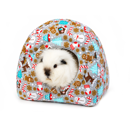 Grey Christmas gingerbread hidey house for guinea pigs featuring a festive cotton outer with gingerbread men, snowmen, candy canes and turquoise Christmas trees, modelled by Swiss Roll