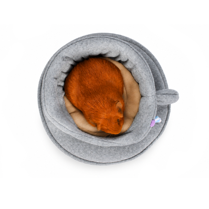 Grey teacup-shaped guinea pig bed viewed from above showing the cosy interior