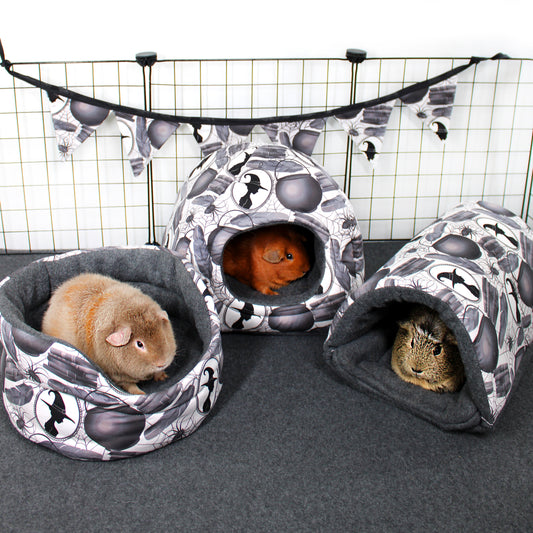 Pet bed and tunnel with guinea pigs inside on a grid background