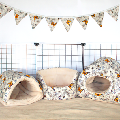Large Steampunk Butterfly Bunting, hanging on a wall above a guinea pig Cage
