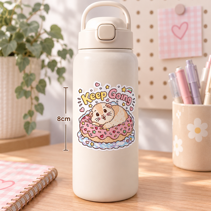 Keep Going Halloumi guinea pig sticker on a white water bottle