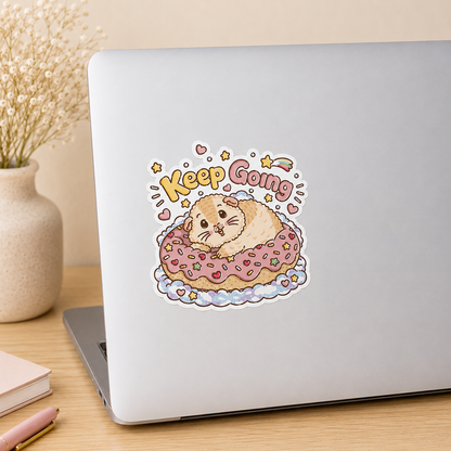 Keep Going Halloumi guinea pig sticker on a laptop