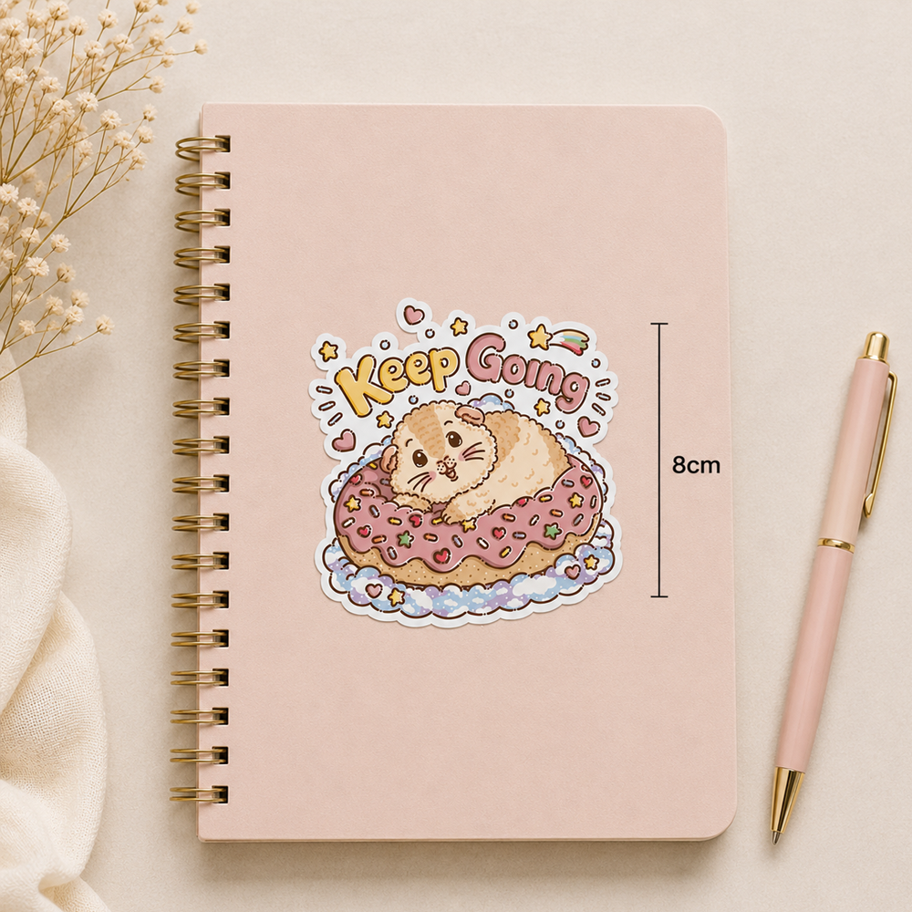 Keep Going Halloumi guinea pig sticker on a pink notebook