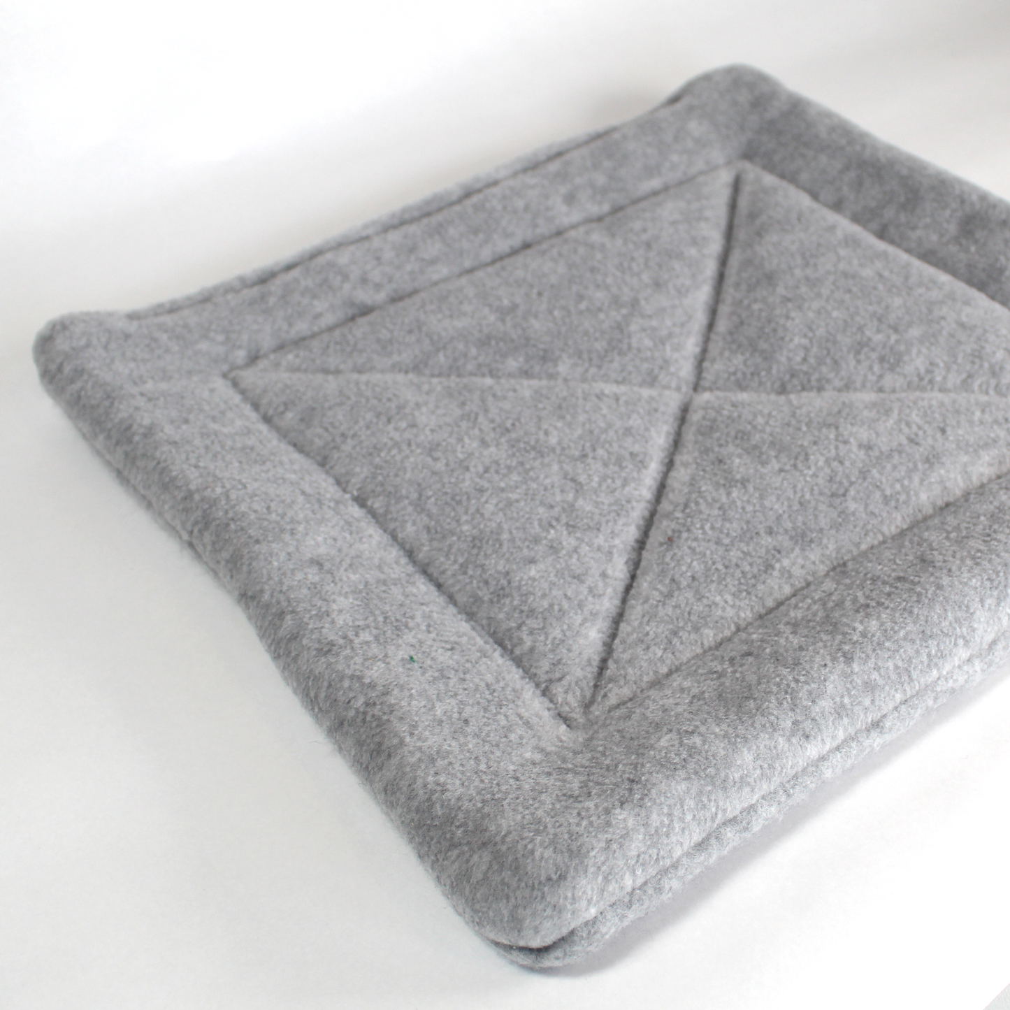 Large Square Grey Pee Pad for Guinea Pigs, front view of the pee pad with out a guinea pig
