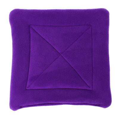 Purple fleece pee pad with a central diamond pattern on a white background