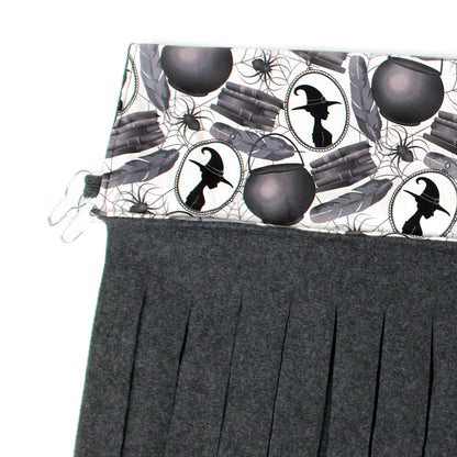 Gray pleated skirt with Halloween-themed pattern on a white background
