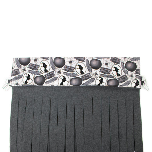 Black pleated skirt with Halloween-themed top section on a white background
