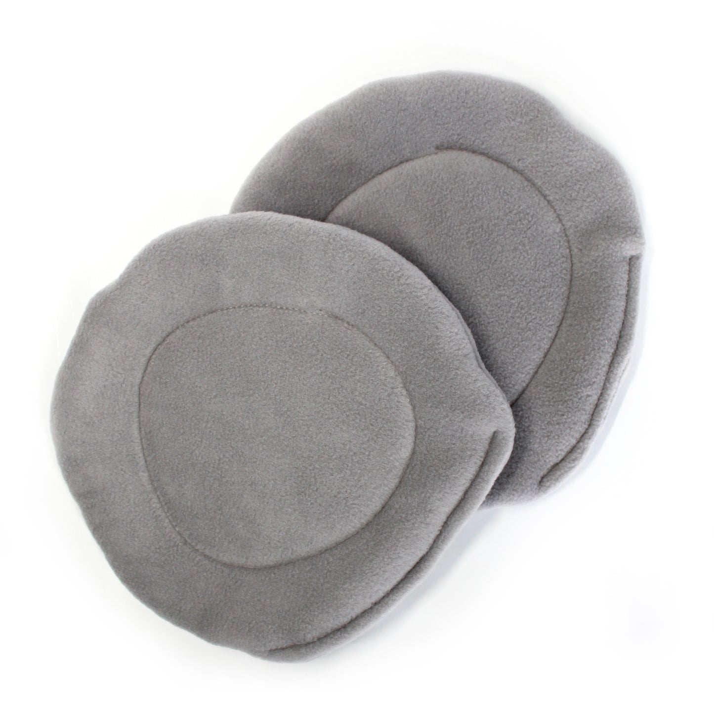 Pair of guinea pig pee pads on a white background