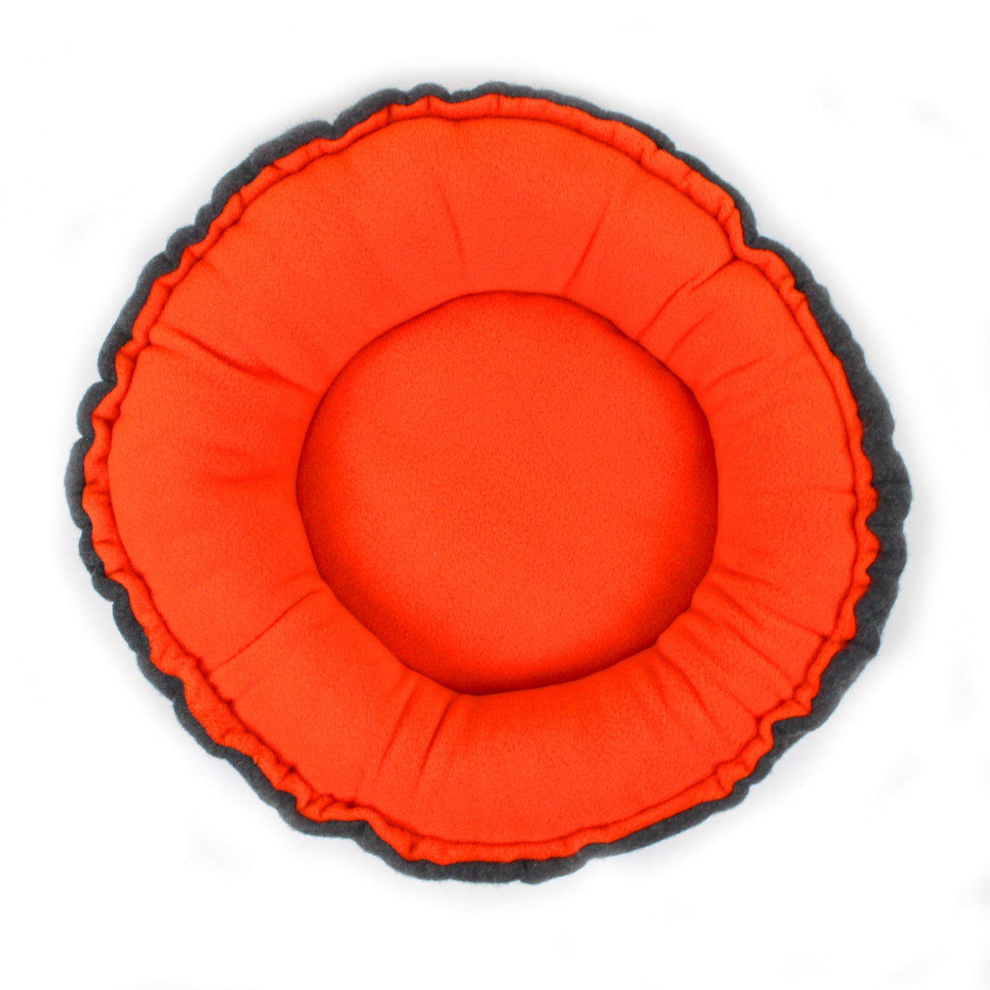 Round orange cushion with black rim on a white background