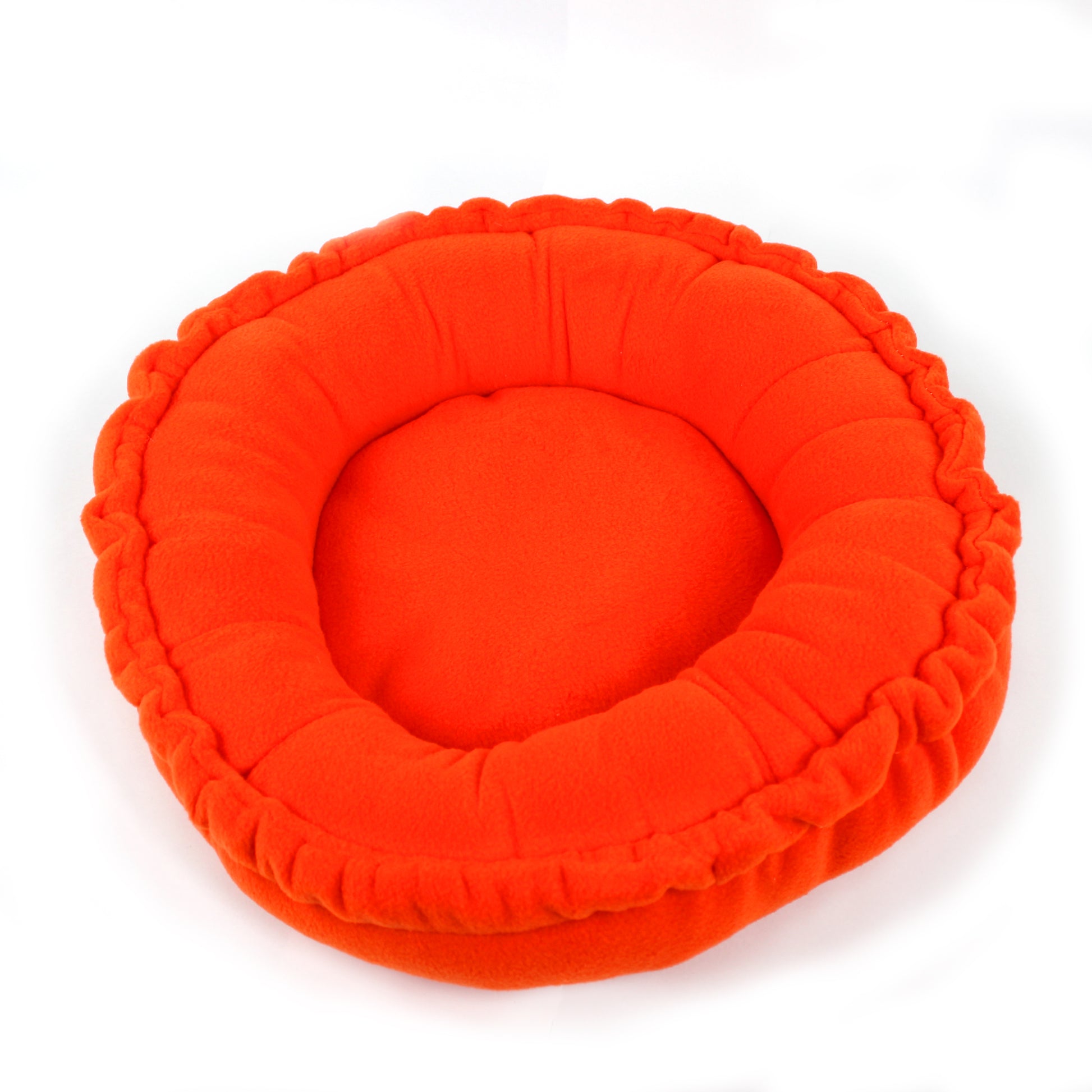 Orange pet bed on a white background