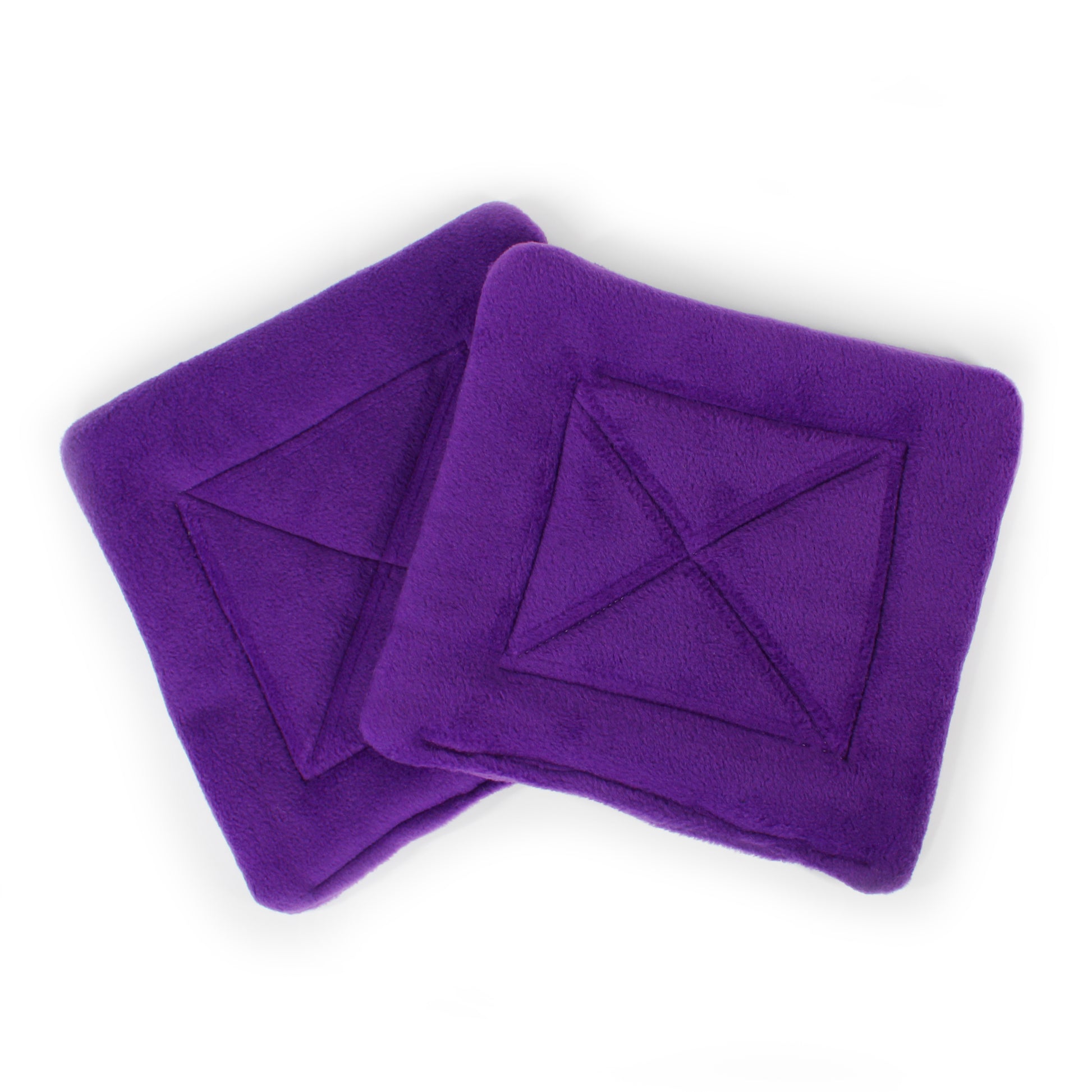 Two purple square pee pads with star patterns on a white background