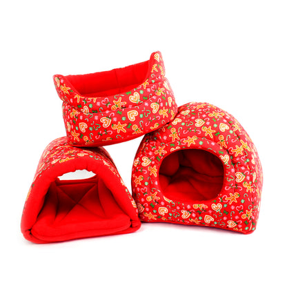 Three red pet houses with festive gingerbread man pattern on a white background