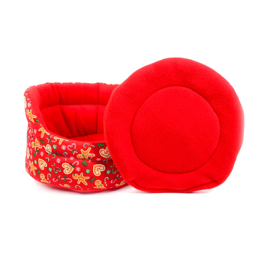 Red pet bed with a floral pattern on a white background