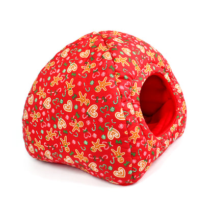 Red pet bed with gingerbread pattern on a white background