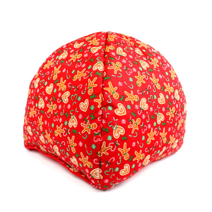 Red fabric block with Christmas-themed pattern on a white background