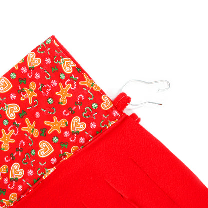 Red fabric with Christmas-themed pattern on a white background