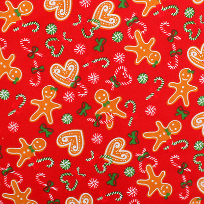 Christmas-themed fabric pattern with gingerbread men, candy canes, and stars on a red background.