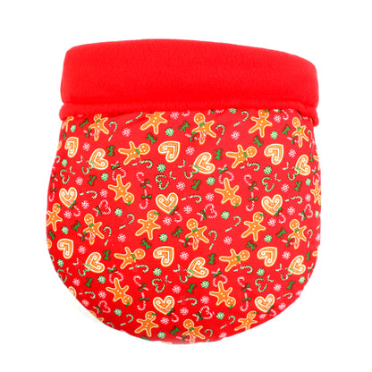 Red snuggle sack with Christmas-themed gingerbread pattern on a white background