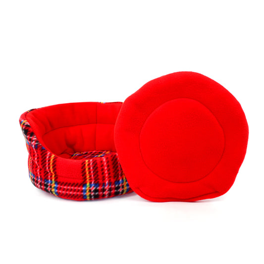 Red pet bed with plaid pattern on a white background