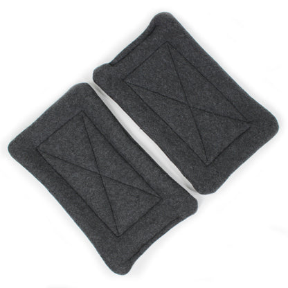 Two gray fleece pee pads with geometric design on a white background