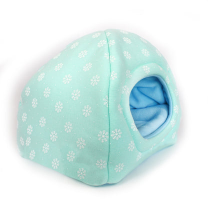 Light blue pet bed with snowflake pattern on a white background