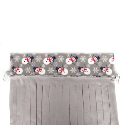 Gray pleated curtain with snowman pattern on top