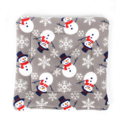 Plush blanket with snowman pattern on a gray background