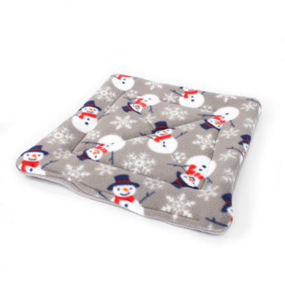 Folded blanket with snowman pattern on a white background
