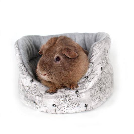 Halloween Spider Cuddle Cup Bed, front view with a cosy guinea pig inside the bed