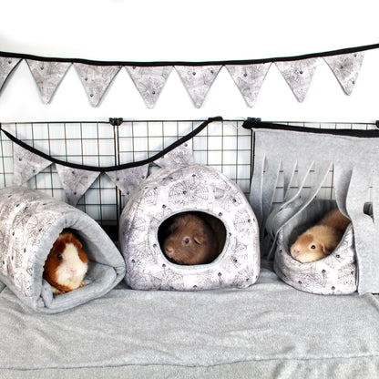 Halloween Spider Guinea Pig Accessory Bundle, Cuddle cup bed, Snuggle tunnel and hidey house in a full cage set up along with bunting and  a corner fleece forest to make a halloween themed cage for guinea pigs