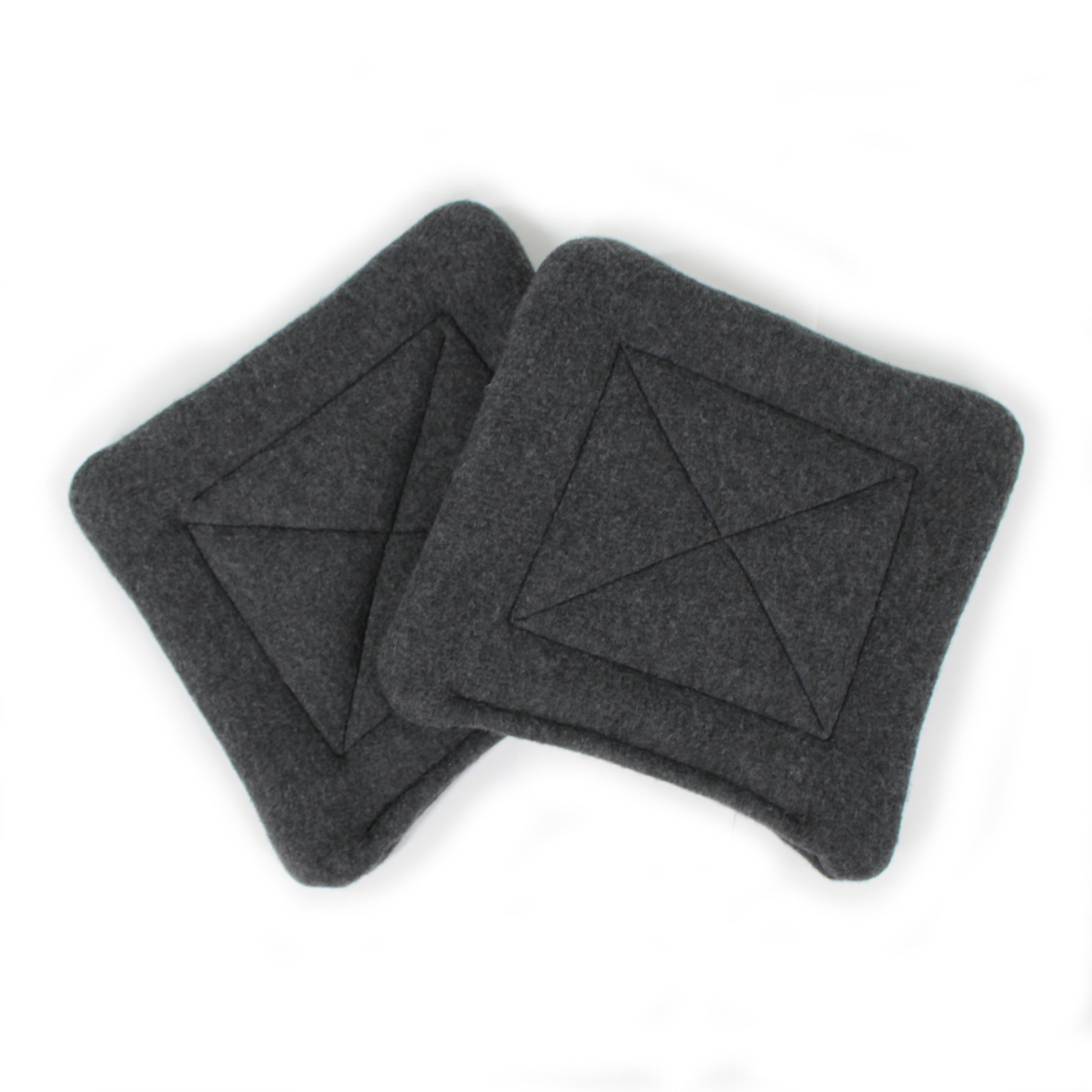 Two dark gray square coasters with a geometric pattern on a white background