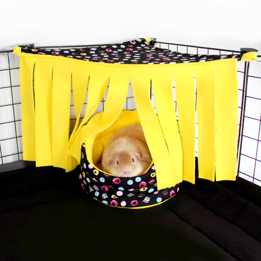 Liquorice Allsorts Corner Fleece Forest for Guinea Pigs, Guinea Pig in a cuude cup bed with the corner fleece forest over the top of it